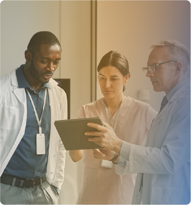 Medical staff reviewing results on tablet